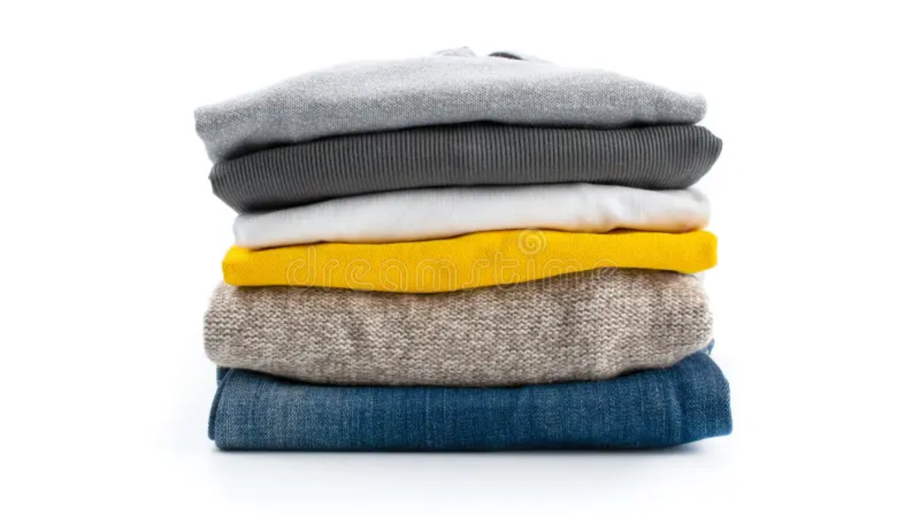 vertical-shot-stack-folded-clothes-vertical-shot-stack-folded-clothes-isolated-white-background-216764562